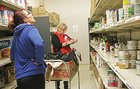 Woman picking supplies at a food bank